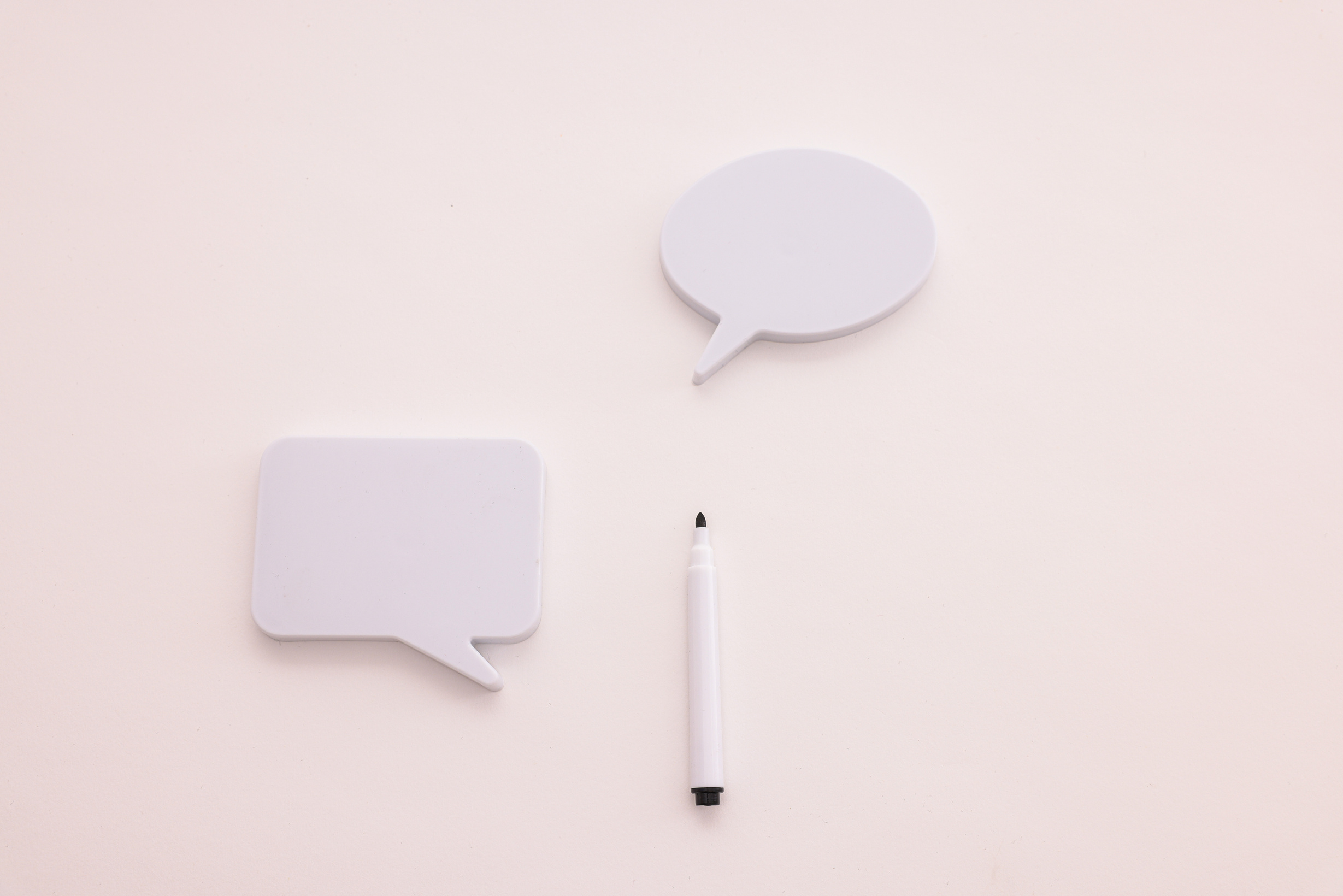 Blank Speak Up Board Beside a Pen